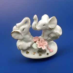Vtg Porcelain Figurine Two Elephants on See-Saw Teeter Totter Pink Flowers Decor